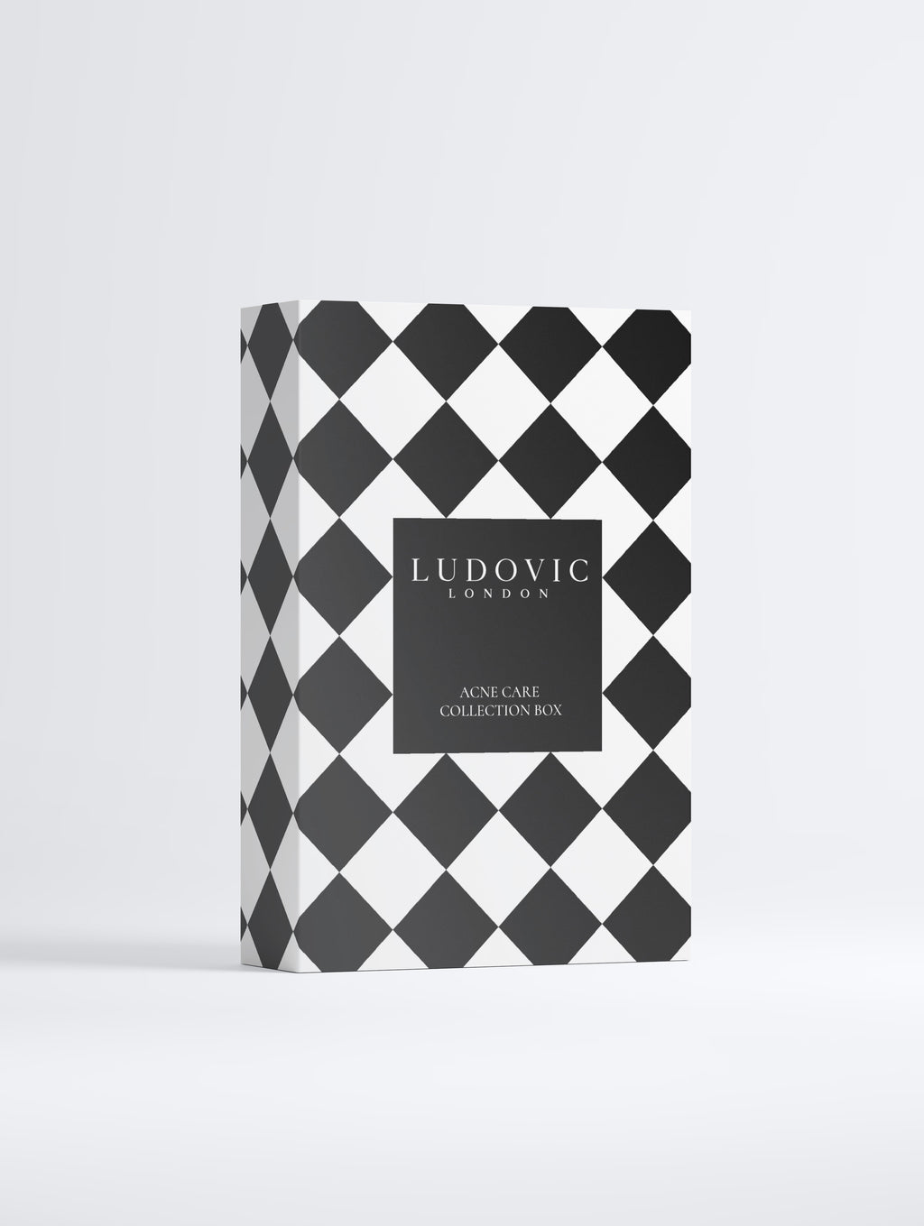 Ludovic London Skincare Collection Box with a black and white harlequin diamond pattern and a central black label.